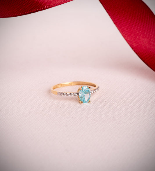 18K SORTIJA ORO BICOLOR TOPACIO NATURAL PARAIBA OVAL 7X5MM 0,93 QTS. Y CIRCONITAS