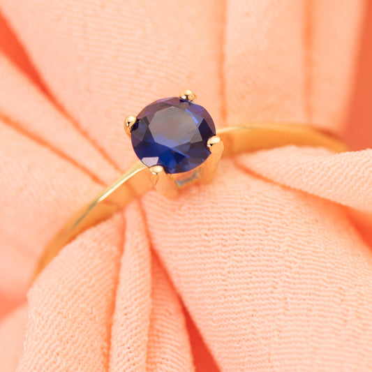 18K SOLITARIO ORO AMARILLO CON CIRCONITA AZUL 4 GARRAS DE 5 MM