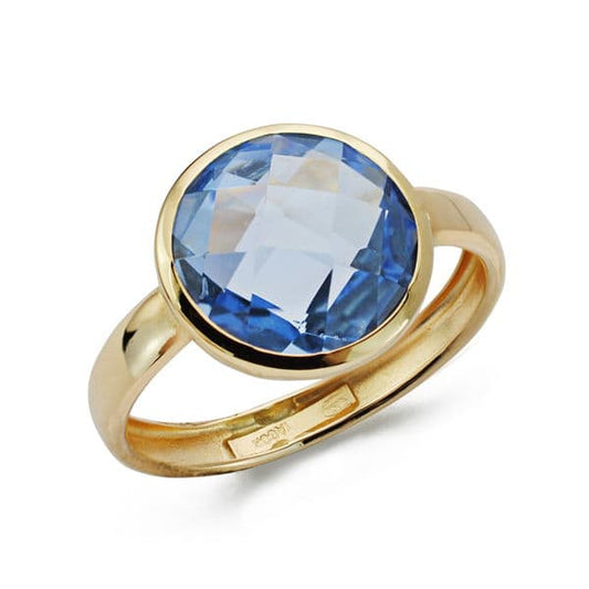 9K SORTIJA ORO AMARILLO CON CIRCONITA AZUL EN BOCEL. ANCHO: 12 MM