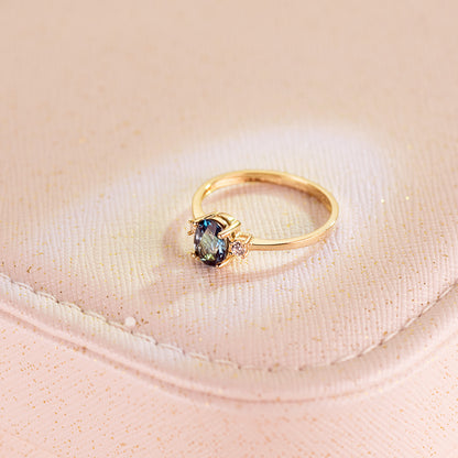 18K SORTIJA ORO AMARILLO PIEDRA AZUL BLUE LONDON 7 X 5MM Y CIRCONITA LATERALES
