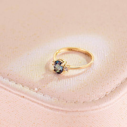 18K SORTIJA ORO AMARILLO PIEDRA AZUL BLUE LONDON 7 X 5MM Y CIRCONITA LATERALES
