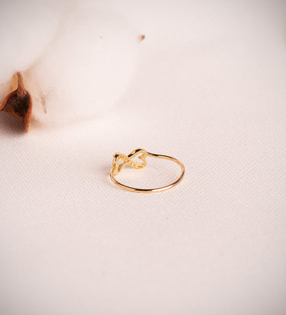 18K SORTIJA ORO AMARILLO CORAZONES CALADOS UNIDOS CON CIRCONITAS. ANCHO: 6 MM C. AMOR