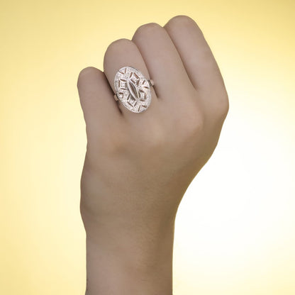 18K SORTIJA ORO BLANCO MOTIVO LANZADERA 23X15 MM CON CIRCONITAS. ANCHO: 23 MM