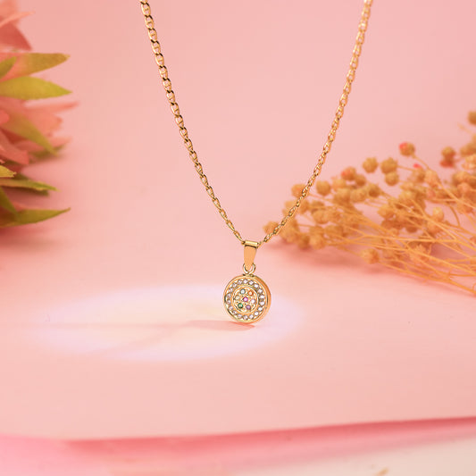18K COLGANTE ORO AMARILLO CON CIRCONITA BLANCAS Y MULTICOLOR. DIAMETRO: 9MM