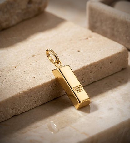 18K COLGANTE AMULETO ORO AMARILLO LINGOTE HUECO EN BRILLO. MEDIDA: 16 X 6 MM