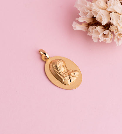18K MEDALLA ORO AMARILLO VIRGEN NIÑA OVAL LISA MATIZADA. MEDIDA: 22 X 14 MM