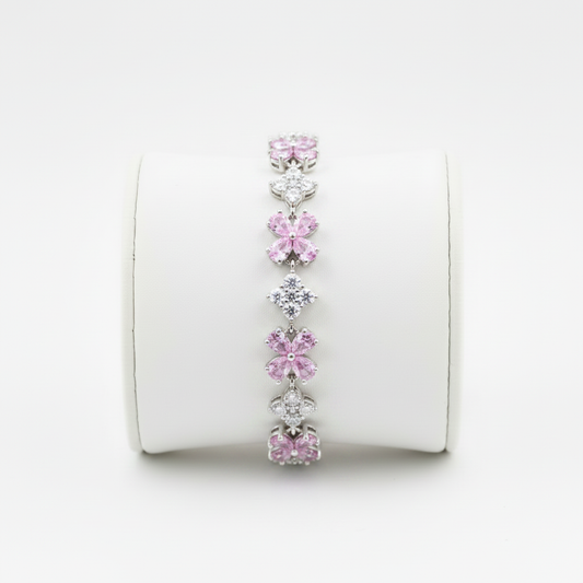 Brazalete rosa en expositor blanco