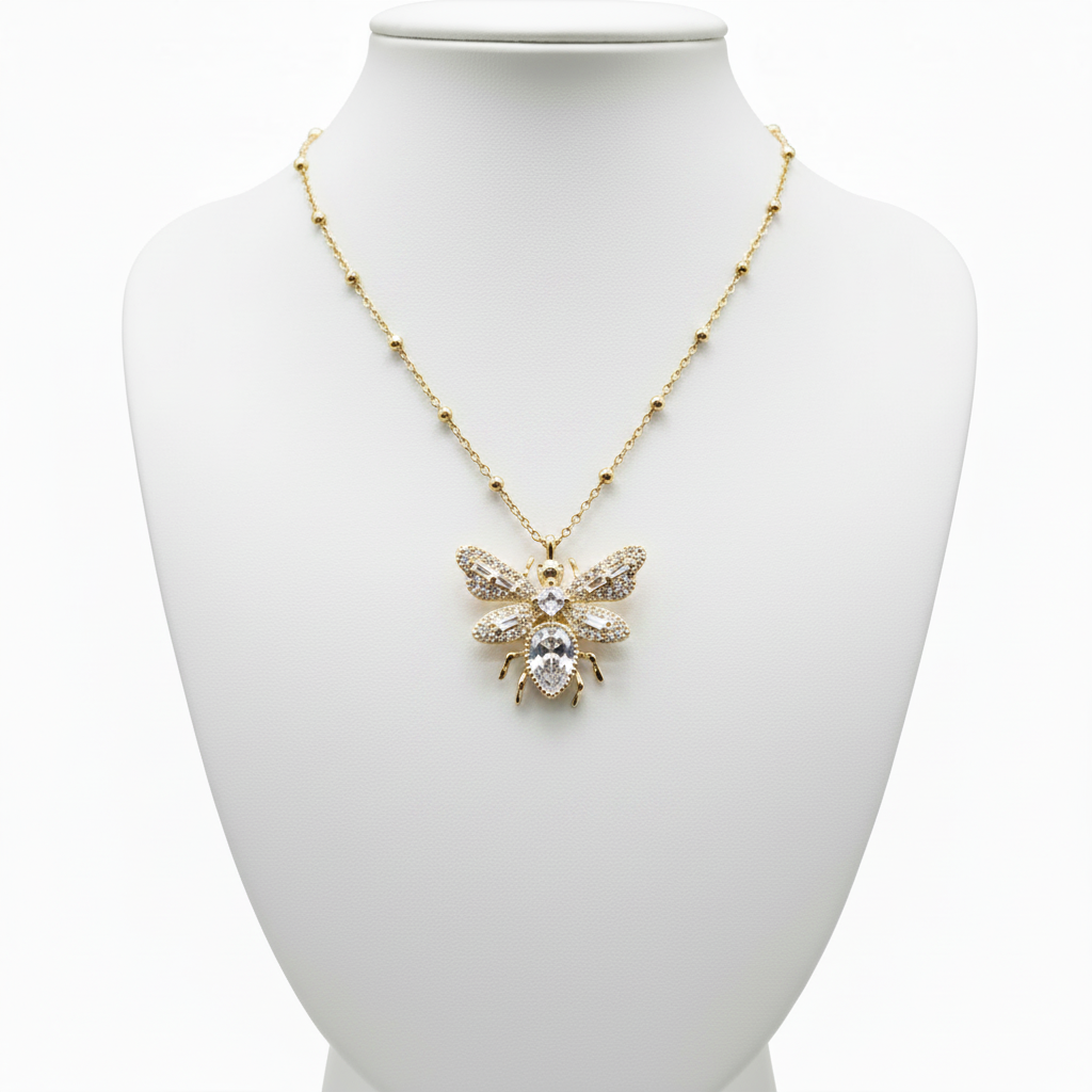 Collar abeja en expositor blanco