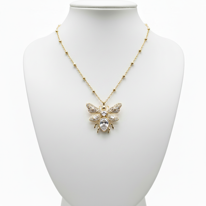 Collar abeja en expositor blanco
