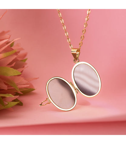 18K GUARDAPELO DIJE PORTAFOTOS OVAL ORO AMARILLO LABRADO. 24X17 MM