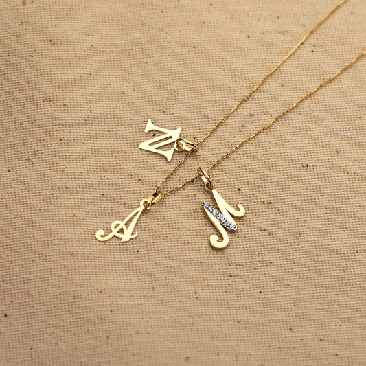 18K COLGANTE ORO AMARILLO LETRA " E " 12X6 MM