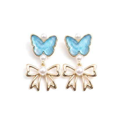 Pendientes Acero inoxidable dorado chapado oro 14ktes cierre presion mariposa nácar azul lazo dorado brillo perla diseño joyería osnor moda 