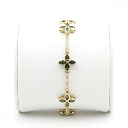 Pulsera de acero inoxidable dorado chapado oro 14ktes circonitas blancas engastadas y verdes diseño joyería osnor 