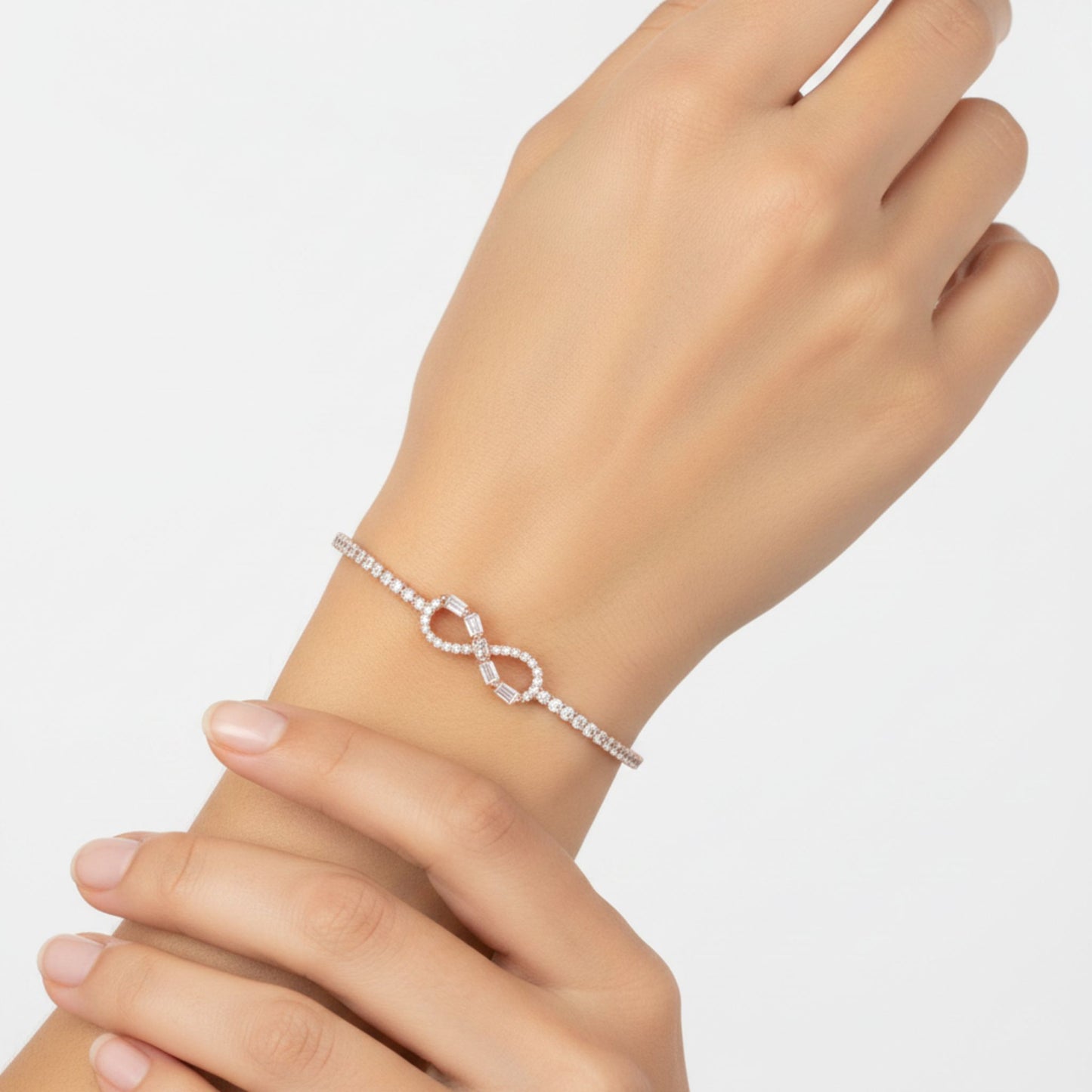 Pulsera Infinito con Circonitas Plata con Baño Oro Rosa. Joyeria Osnor