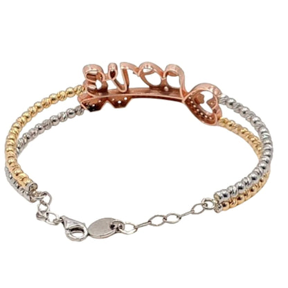 Mujer Luciendo Pulsera Doble Cadena de Bolas "LOVE" en Plata con Baño de Oro Amarillo y Oro Rosa. Joyeria Osnor